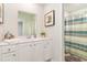 Well-lit bathroom featuring a vanity with sink, mirror, and shower with curtain at 8081 Bear Claw Way, Conway, SC 29526