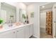 Modern bathroom with double sink vanity, mirrors, and shower with contemporary curtain at 8081 Bear Claw Way, Conway, SC 29526