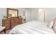 Bedroom with a wooden dresser, a comfortable-looking bed, and a view to the dining room at 8081 Bear Claw Way, Conway, SC 29526