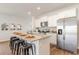Bright kitchen boasts white cabinets, granite counters, a large island, and stainless-steel appliances at 8081 Bear Claw Way, Conway, SC 29526