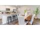 Stylish kitchen island with granite countertops and stainless steel appliances next to dining area at 8081 Bear Claw Way, Conway, SC 29526