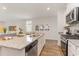 Well-appointed kitchen features a granite countertop, stainless-steel appliances and seamless connection to dining and living spaces at 8081 Bear Claw Way, Conway, SC 29526