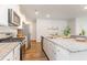 Well-appointed kitchen featuring stainless steel appliances, granite countertops, and ample cabinet space at 8081 Bear Claw Way, Conway, SC 29526