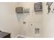 Functional laundry area equipped with shelving for storage and hookups for laundry machines at 8081 Bear Claw Way, Conway, SC 29526