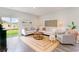 Bright living room with modern decor, comfortable seating, and a stylish rug, creating a welcoming atmosphere at 8081 Bear Claw Way, Conway, SC 29526