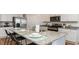 Beautiful kitchen island with granite countertop, breakfast bar seating and stainless steel appliances at 8085 Bear Claw Way, Conway, SC 29526