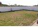 A large grassy backyard enclosed by a white fence is a key feature at 1001 Leatherman Rd., Conway, SC 29527