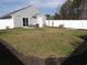View of the backyard with a patio set and a white privacy fence at 1001 Leatherman Rd., Conway, SC 29527