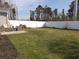The spacious backyard has a patio set and a long white fence at 1001 Leatherman Rd., Conway, SC 29527