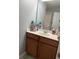 Bathroom vanity with dark wood cabinets and a white countertop, complete with a large mirror at 1001 Leatherman Rd., Conway, SC 29527