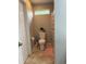 Clean bathroom featuring a toilet, decorative plant, and a light-colored shower curtain at 1001 Leatherman Rd., Conway, SC 29527