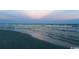 Calm beach scene at dusk with the ocean reflecting a colorful sunset at 1001 Leatherman Rd., Conway, SC 29527