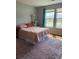 Cozy bedroom with a large window and natural light, complete with a plush area rug at 1001 Leatherman Rd., Conway, SC 29527