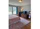 Bright bedroom boasts a large window, hardwood floors, and a modern dresser and mirror at 1001 Leatherman Rd., Conway, SC 29527