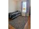 Bedroom with a black and white striped bed, grey rug, and natural lighting at 1001 Leatherman Rd., Conway, SC 29527