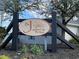 St. John's Ridge entrance sign is beautifully framed by lush greenery and mature trees, creating a welcoming atmosphere at 1001 Leatherman Rd., Conway, SC 29527