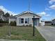 Charming single story home featuring gray siding, blue shutters, well-maintained lawn, and inviting front entrance at 1001 Leatherman Rd., Conway, SC 29527