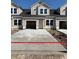 New construction townhomes with garages and concrete driveways offer modern living at 2042 Wild Indigo Circle Nw # 204, Calabash, NC 28467