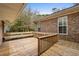 Spacious wooden back deck, complete with built-in seating and charming wood railings at 5616 N Kings Hwy., Myrtle Beach, SC 29577