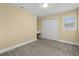 Inviting bedroom featuring neutral walls, built-in desk, and a closet with bi-fold doors at 5616 N Kings Hwy., Myrtle Beach, SC 29577