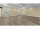 Expansive bedroom with tray ceiling, recessed lighting, and shuttered windows at 5616 N Kings Hwy., Myrtle Beach, SC 29577