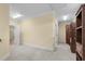 Large bonus room with carpet flooring, neutral colored walls, and crown molding at 5616 N Kings Hwy., Myrtle Beach, SC 29577