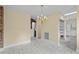 Bright dining room features a chandelier, neutral walls, and an open layout at 5616 N Kings Hwy., Myrtle Beach, SC 29577