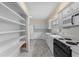 Efficient kitchen with white cabinets, modern appliances, and ample counter space at 5616 N Kings Hwy., Myrtle Beach, SC 29577
