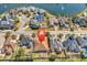 Stunning aerial view of property highlighting its desirable location in a lush community near a tranquil lake at 129 Waterfall Circle, Little River, SC 29566