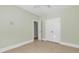 Bedroom features neutral paint, tiled floors, closet and white trim at 129 Waterfall Circle, Little River, SC 29566