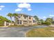 Elegant two-story building with a circular window design, featuring a grand entrance and beautifully landscaped surroundings at 129 Waterfall Circle, Little River, SC 29566