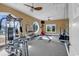Well-equipped gym with modern exercise machines, free weights, and plenty of natural light for a complete fitness experience at 129 Waterfall Circle, Little River, SC 29566