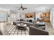 Living room with kitchen, tile floors, door and furniture staged in the space at 129 Waterfall Circle, Little River, SC 29566