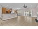 Open-concept living room with kitchen, tile floors, fireplace and plenty of natural light at 129 Waterfall Circle, Little River, SC 29566