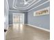 Spacious living room with beautiful ceiling detail and natural light from large windows at 129 Waterfall Circle, Little River, SC 29566