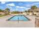 Inviting community pool surrounded by lush landscaping, offering a refreshing escape for residents and guests at 129 Waterfall Circle, Little River, SC 29566