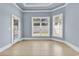 Light-filled sitting room with bay windows and neutral tile flooring at 129 Waterfall Circle, Little River, SC 29566
