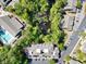 Aerial view showcasing a community pool, pond, and lush landscaping. A beautiful view from above at 1551 Spinnaker Dr. # 5821, North Myrtle Beach, SC 29582