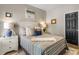 Comfortable bedroom with plantation shutters, wood floors, and beach decor on the walls at 1551 Spinnaker Dr. # 5821, North Myrtle Beach, SC 29582