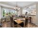 The dining area features plantation shutters for natural light and offers an open view of the breakfast bar and kitchen at 1551 Spinnaker Dr. # 5821, North Myrtle Beach, SC 29582
