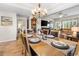 Formal dining room with a large table set for a meal, with views into the living room and a bedroom at 1551 Spinnaker Dr. # 5821, North Myrtle Beach, SC 29582