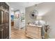 Inviting entryway features light wood floors, decorative mirror, and a glimpse into the kitchen and dining area at 1551 Spinnaker Dr. # 5821, North Myrtle Beach, SC 29582