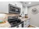 A sleek kitchen design with stainless steel appliances and granite countertops creates a modern culinary space at 1551 Spinnaker Dr. # 5821, North Myrtle Beach, SC 29582