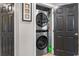 Efficient laundry closet with stacked washer and dryer and convenient storage for supplies at 1551 Spinnaker Dr. # 5821, North Myrtle Beach, SC 29582