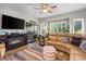 Inviting living room featuring cozy fireplace, ceiling fan, and sliding doors to outdoor patio at 1551 Spinnaker Dr. # 5821, North Myrtle Beach, SC 29582