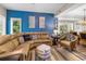 Open living area features a sectional couch and decor and connects to an open dining space at 1551 Spinnaker Dr. # 5821, North Myrtle Beach, SC 29582
