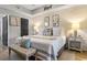 Charming main bedroom with wood accent wall, decorative wall art, and black doors at 1551 Spinnaker Dr. # 5821, North Myrtle Beach, SC 29582