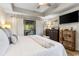 Bright main bedroom with tray ceiling, deck access, and ample dresser and closet storage at 1551 Spinnaker Dr. # 5821, North Myrtle Beach, SC 29582