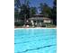 Inviting swimming pool area with lounge chairs and manicured landscaping. Ideal for relaxing by the water at 1551 Spinnaker Dr. # 5821, North Myrtle Beach, SC 29582