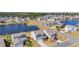 An aerial view of the neighborhood shows houses along a pond at 3304 Candytuft Dr., Conway, SC 29526